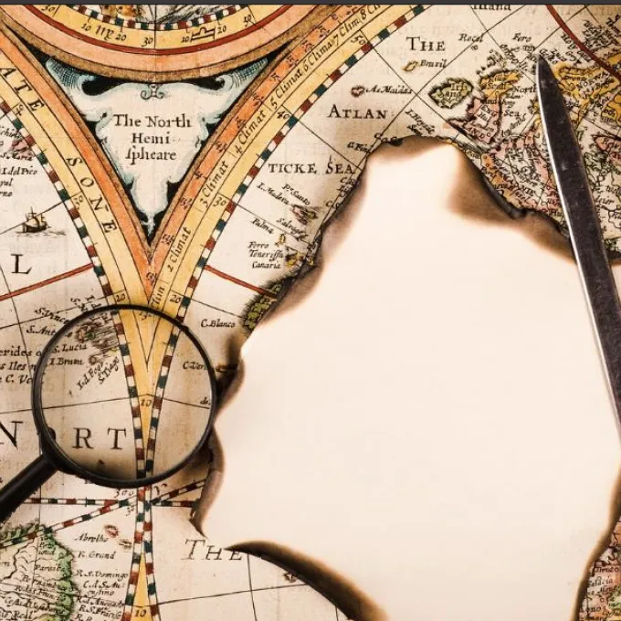 "Vintage style map with magnifying glass"